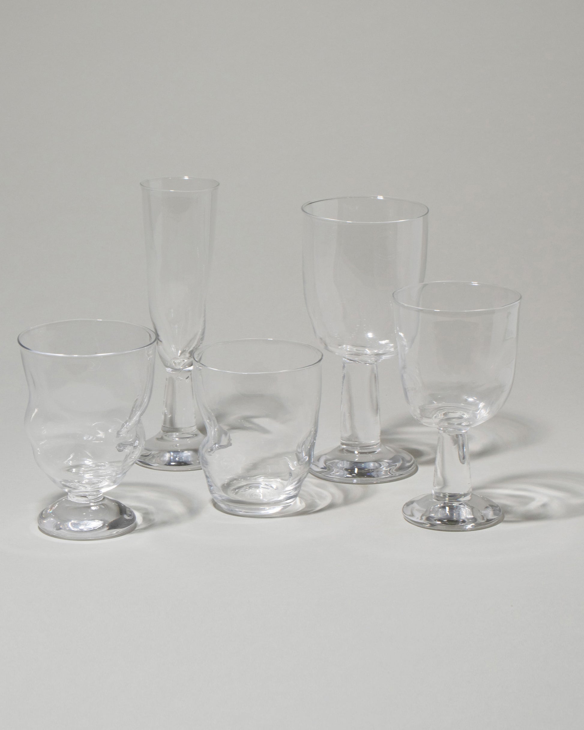 Group of Silje Lindrup Swirl Glassware on light color backgorund.