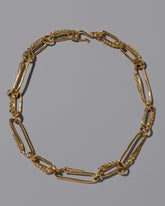 CRZM 22k Gold Ophiolite Necklace on light color background.