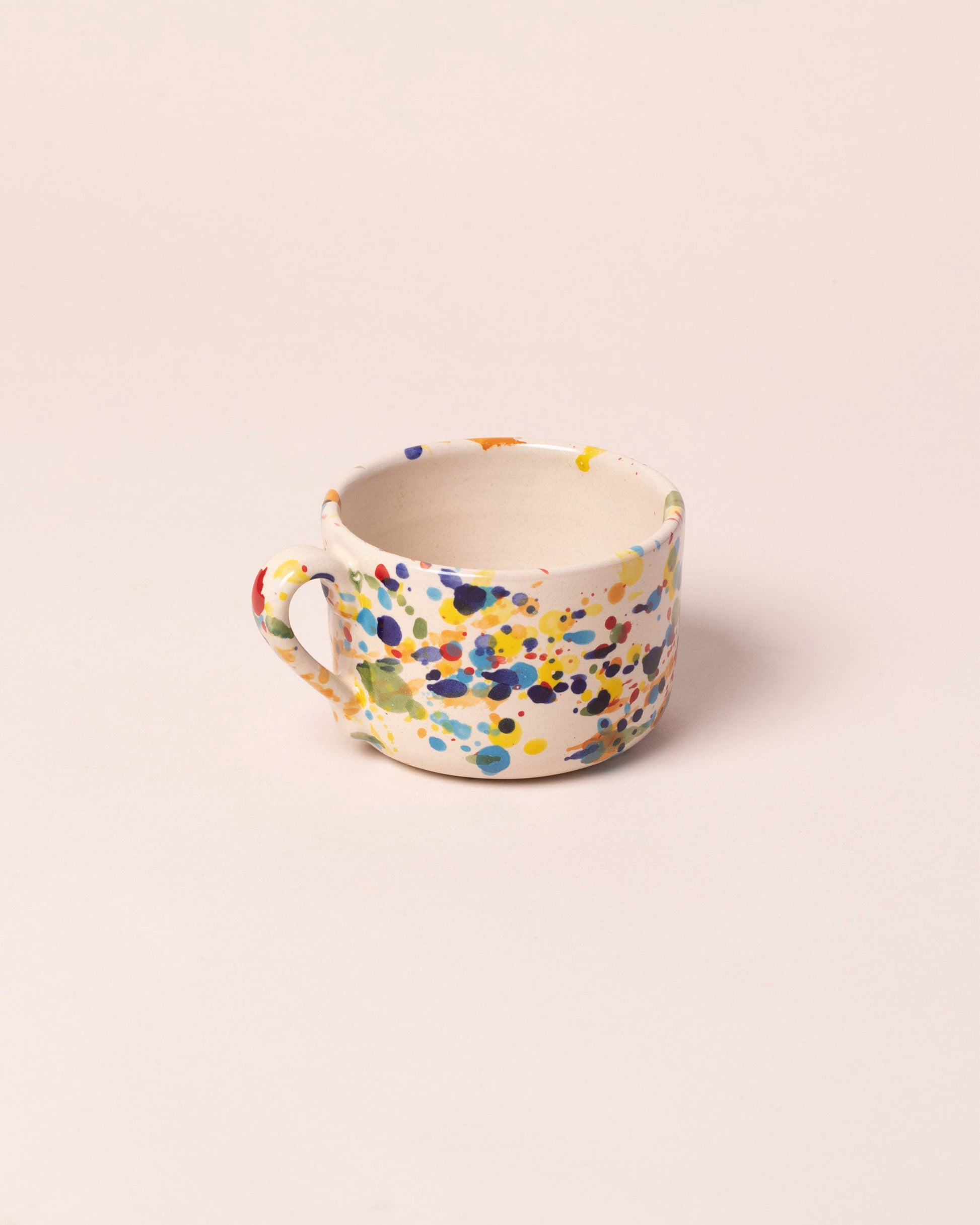 La Ceramica Vincenzo Del Monaco Colored Drops Tea Mug on light color background.