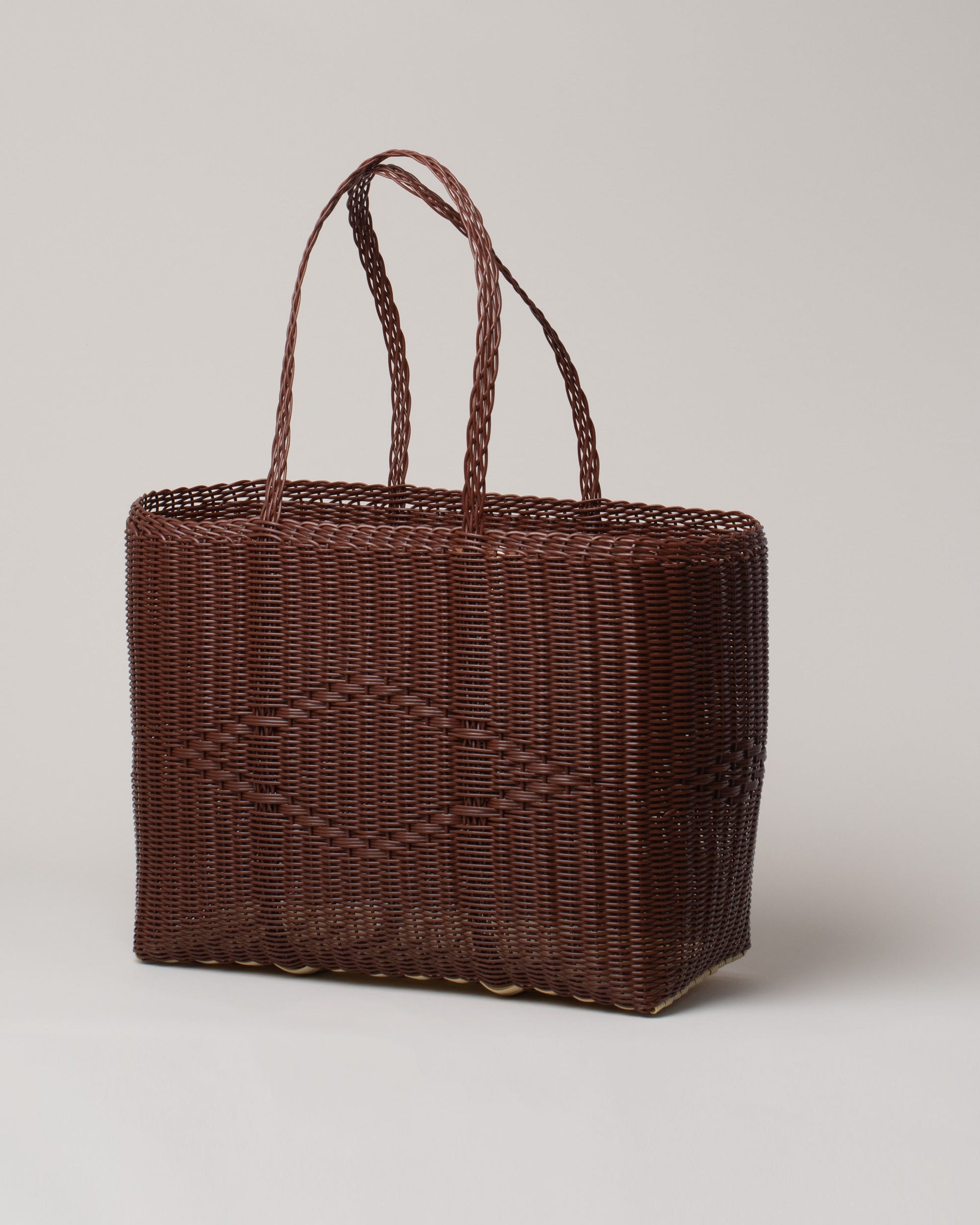 Palorosa Chocolate Large Handwoven Tote Basket Bag on light color background.