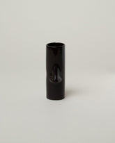 Bonam Kim Black Nose Pillar Vase on light color background.