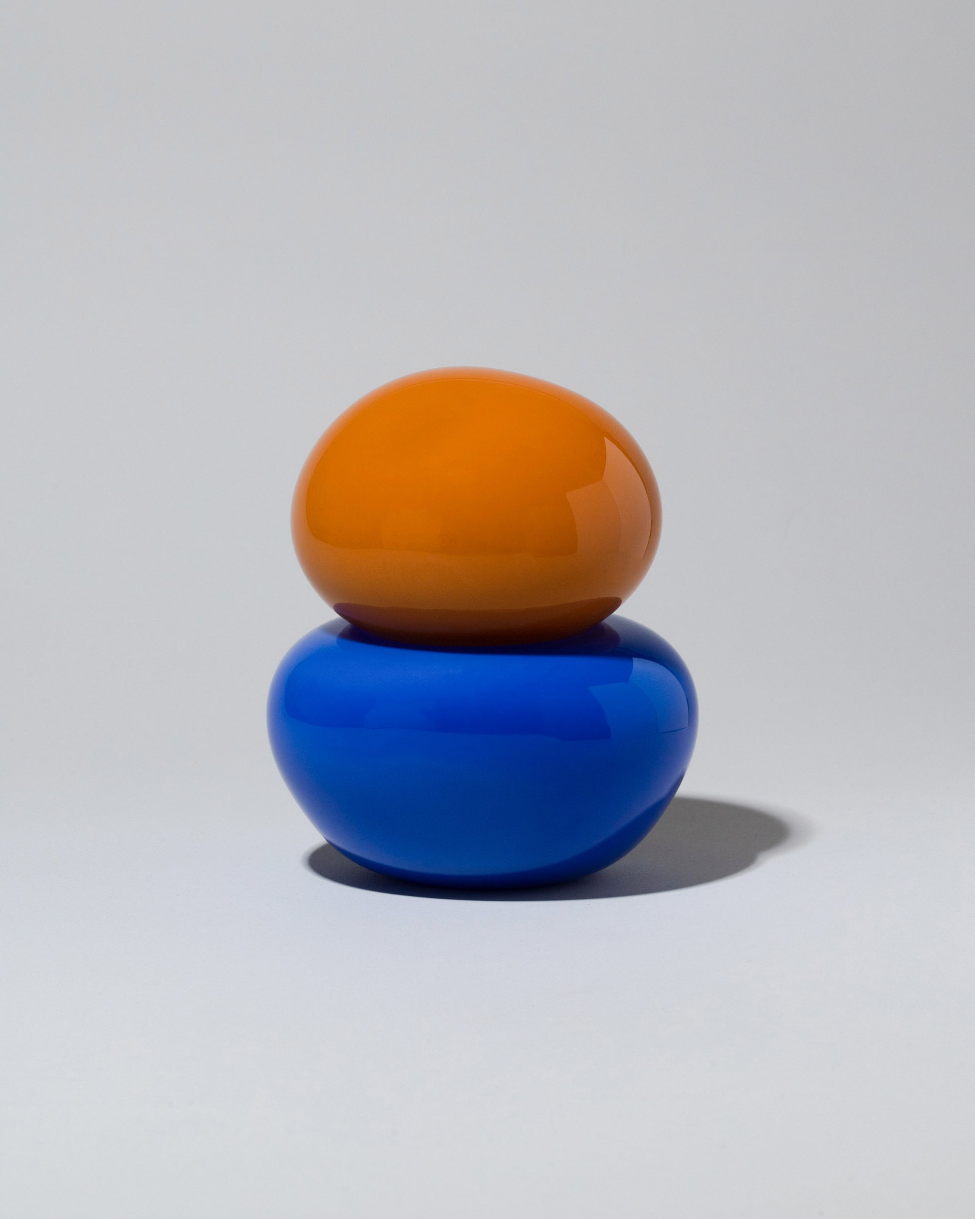 Helle Mardahl Orange & Blue Lollipop Bonbonniere on light color background.