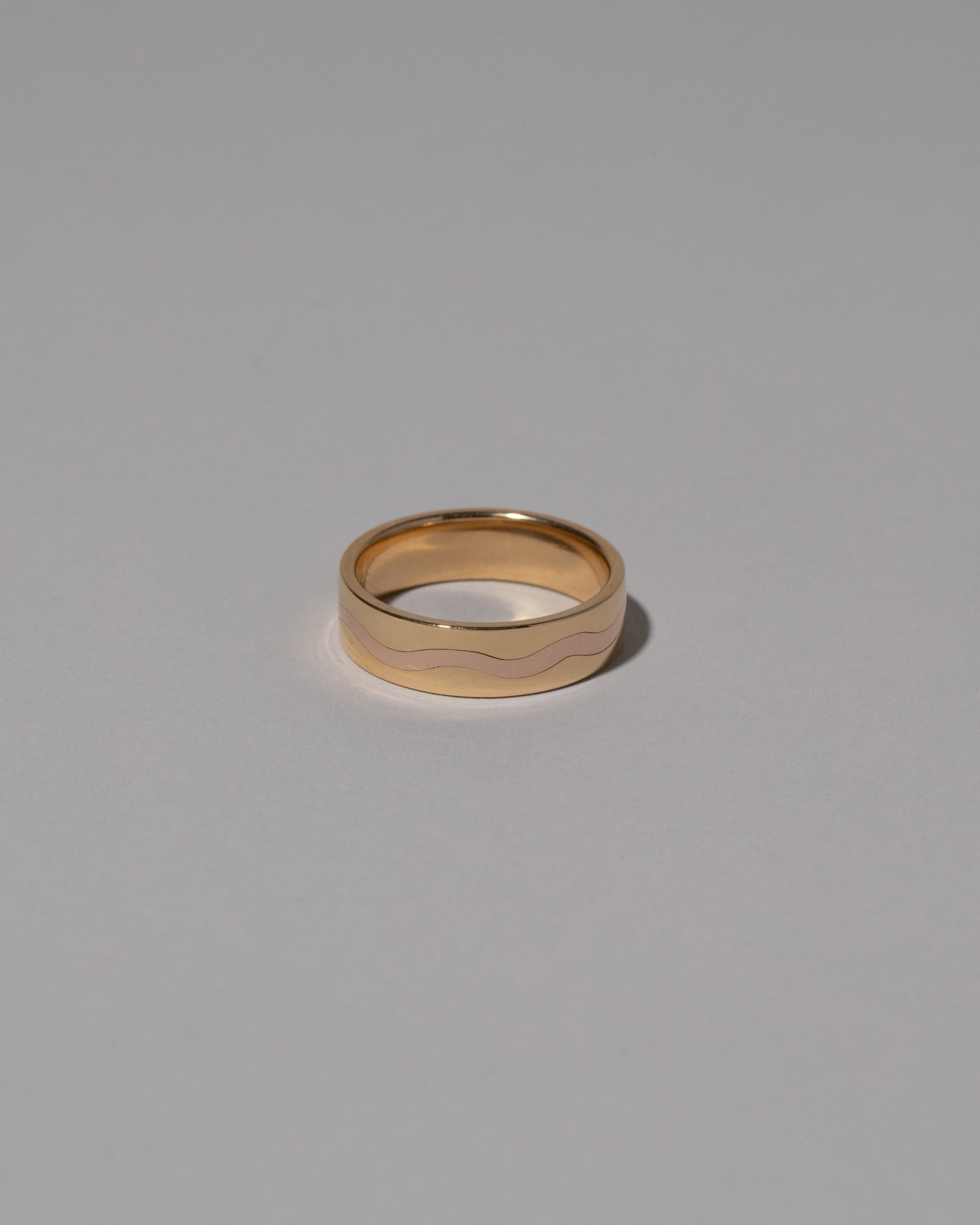 6mm in Yellow Gold & Rose Gold Inlaid Band on light color background.