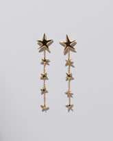 Verve Star Shoulder Duster Earrings 14k Gold on light color background.