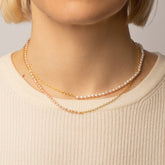 product_details::Half Oval Chain & White Seed Pearl Necklace and Half Oval Chain & Peony Seed Pearl Necklace on model.