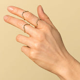 product_details::Gold Five Stone Curve Bands on model.