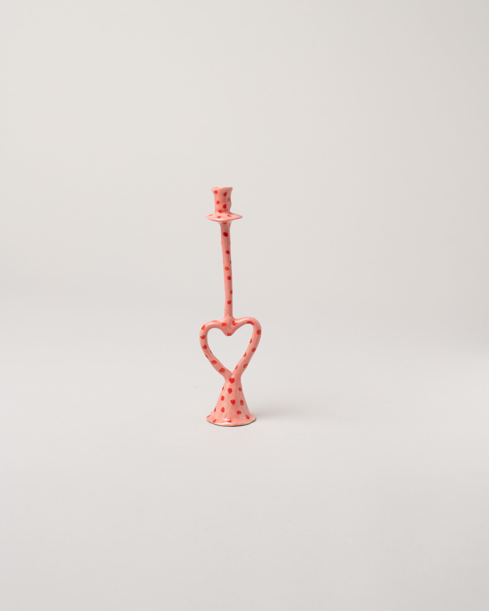 La Romaine Editions Hearts Open Heart-Shaped Candle Holder on light color background.