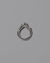 View from the side of the CRZM Sterling Silver Terrane Ring on light color background.