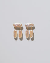 Crake Pearl Earrings on light color background.