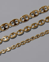 Closeup details of the CRZM 22k Gold Yuba Mini Bracelet, 22k Gold Yuba Medium Bracelet, and 22k Gold Yuba Bracelet on light color background.