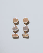 King Fisher Pearl Earrings on light color background.