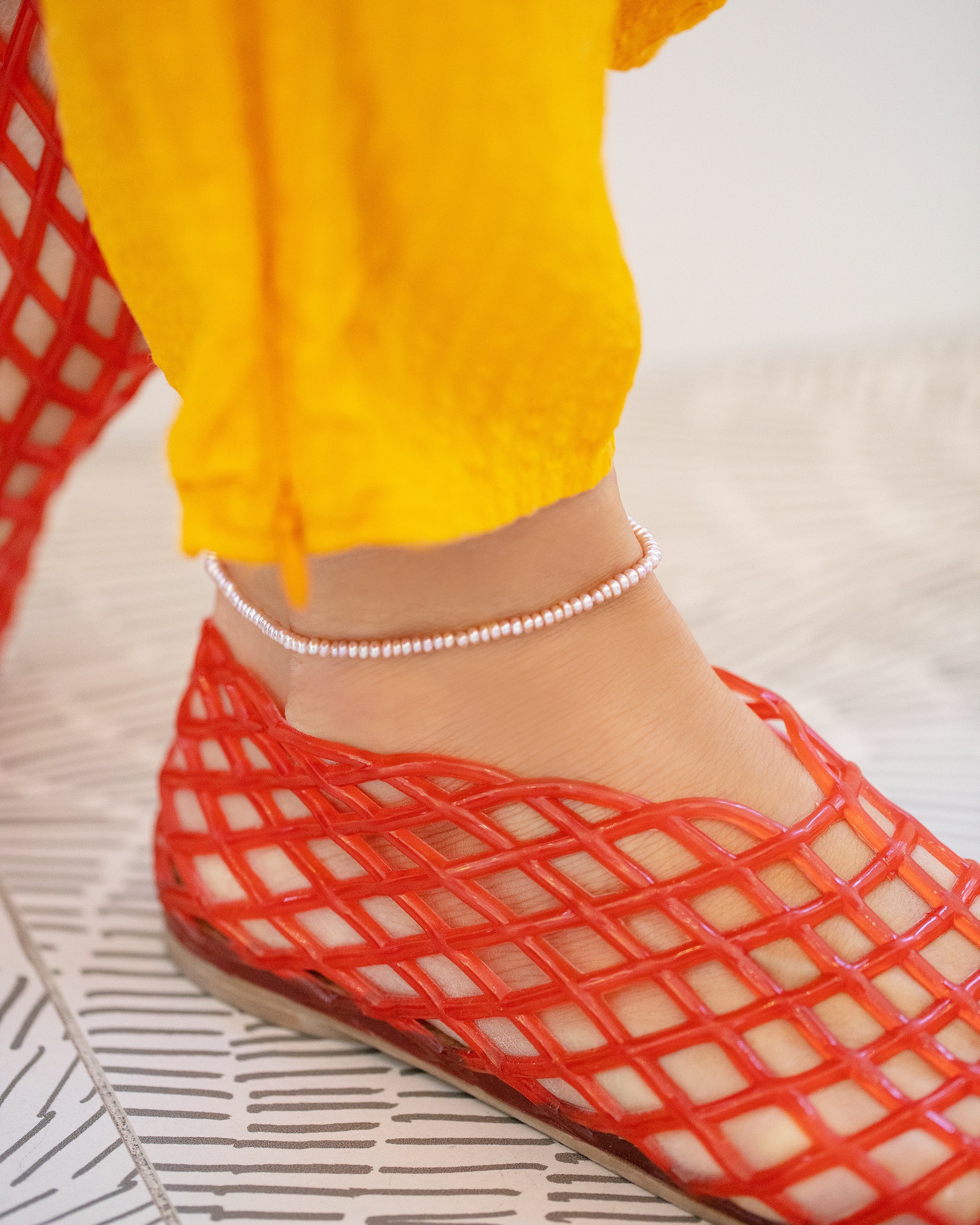 Pink Peony Seed Pearl Anklet on model.