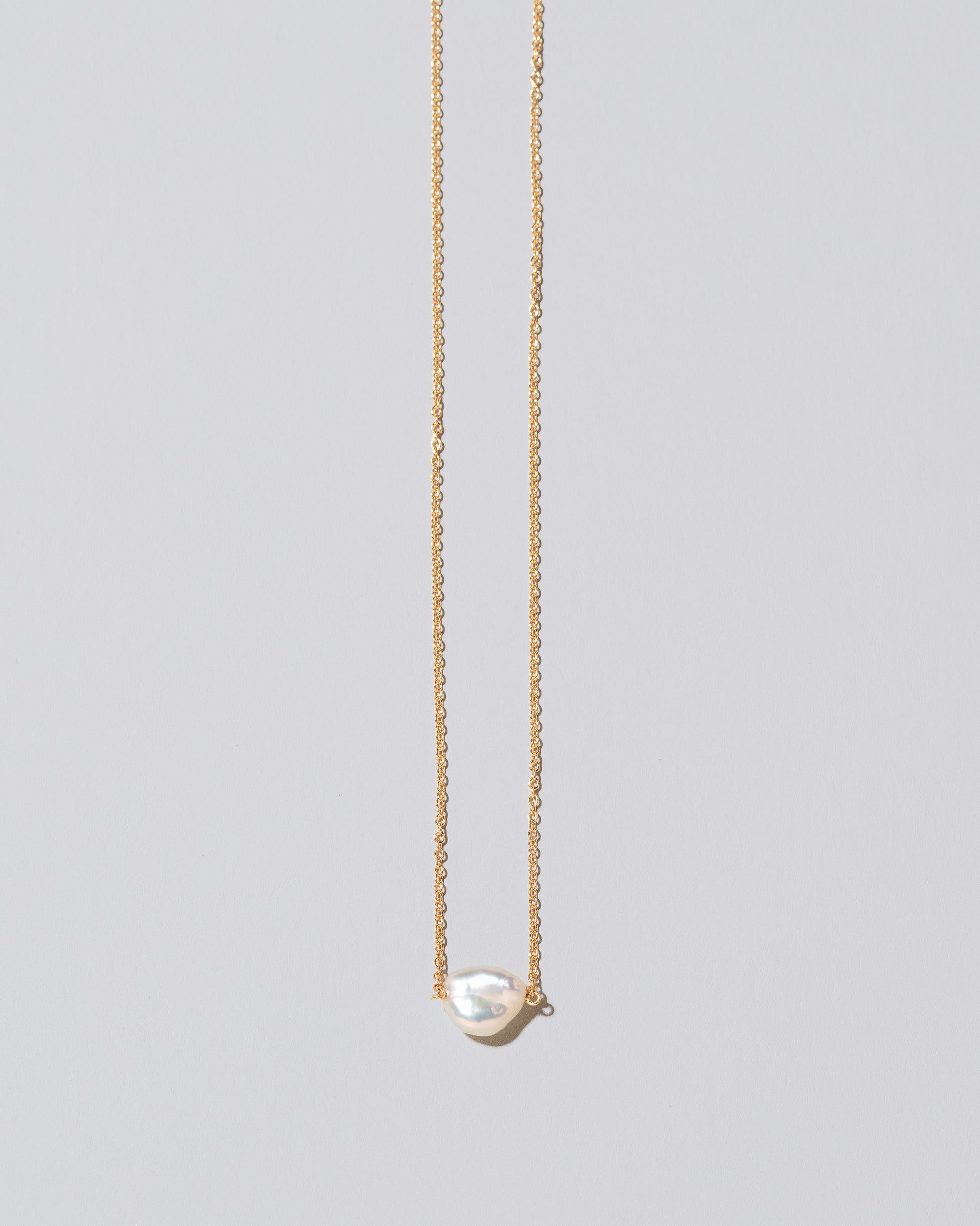 Lagniappe Pearl Necklace White #1 on light color background.