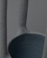 Closeup details of the Solenne Belloir Samples & Imperfects Rod Vase on light color background.