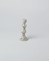 Suzanne Sullivan Two Candleholder on light color background.
