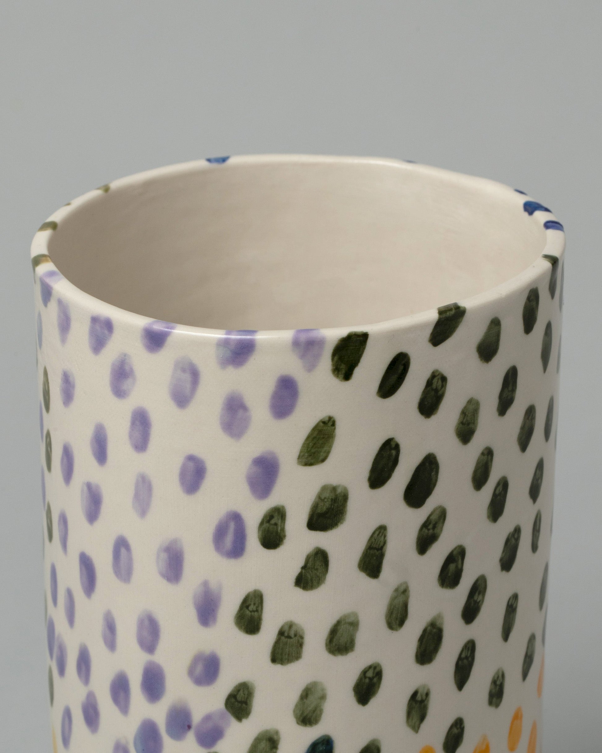 Closeup detail of the Amanda Lucia Côté Dots Vase on light color background.