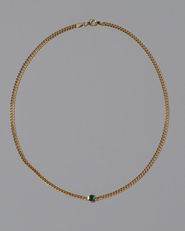 Emerald Fold Necklace on light color background.