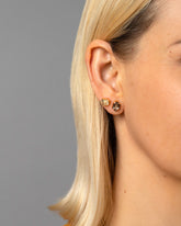 Envelop Earrings on model.