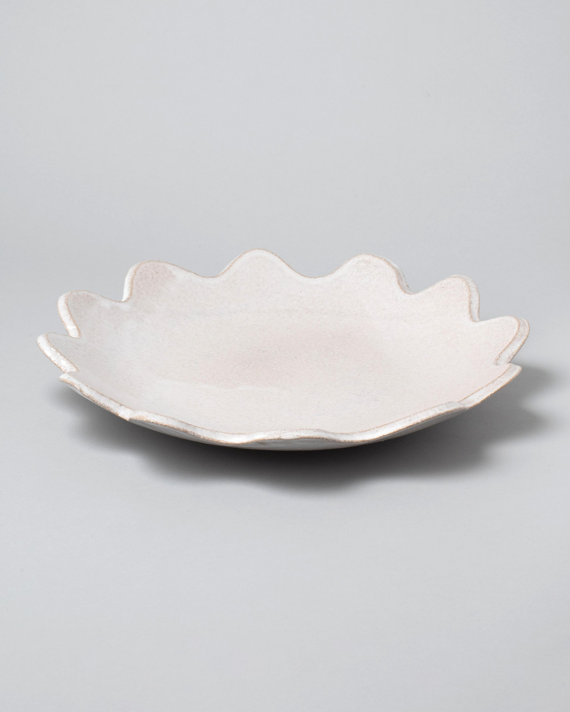 Morgan Peck Pearl Scallop Platter on light color background.