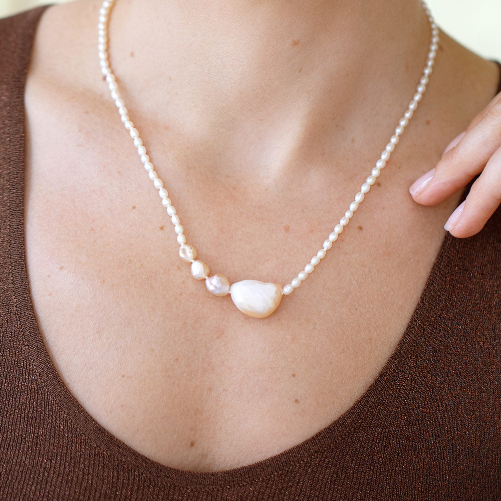 product_details::Tethys Pearl Necklace on model.