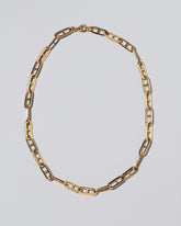 Lightweight Anchor Loop Chain Necklace on light color background.