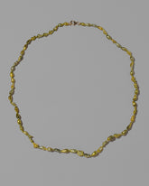 Karkinos Necklace on light color background.