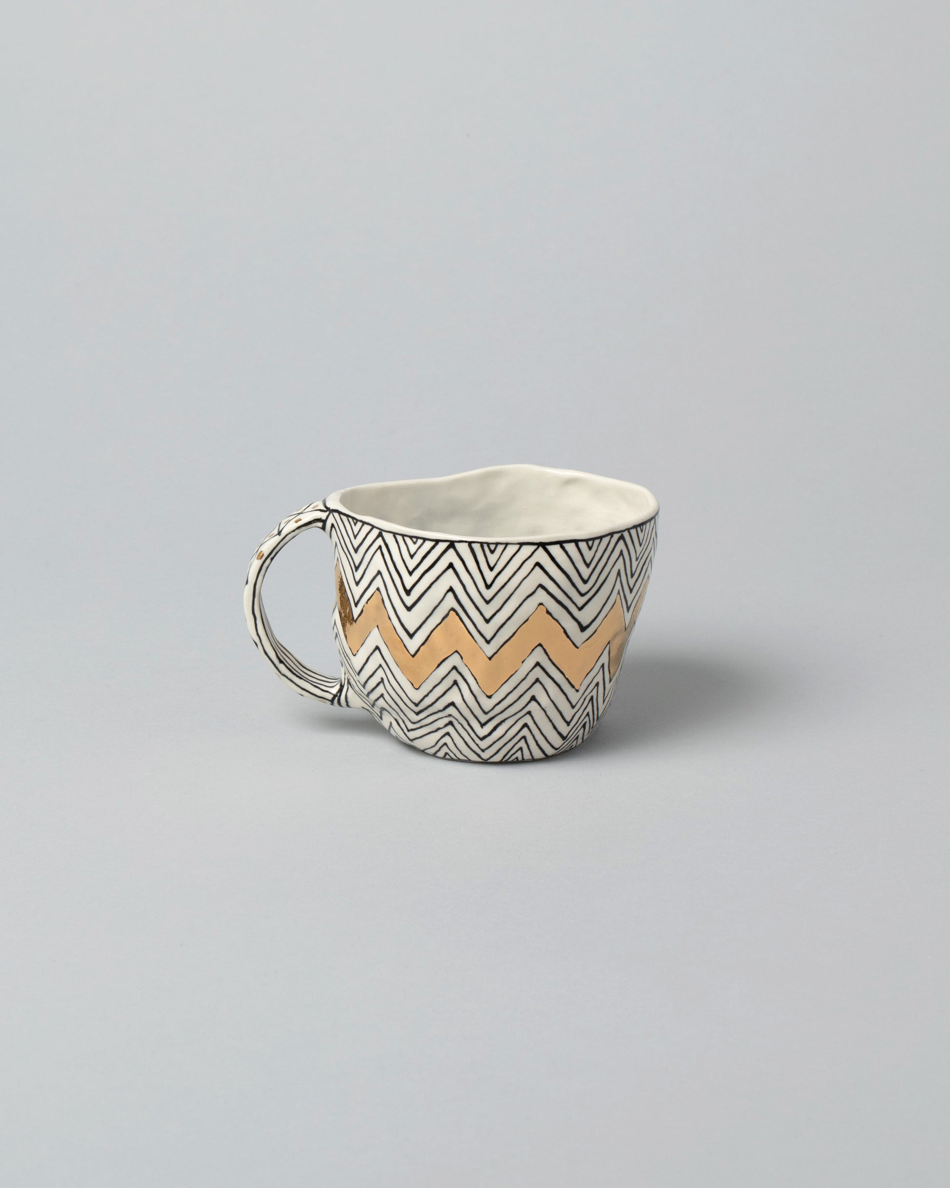 Suzanne Sullivan Two Mug on light color background.
