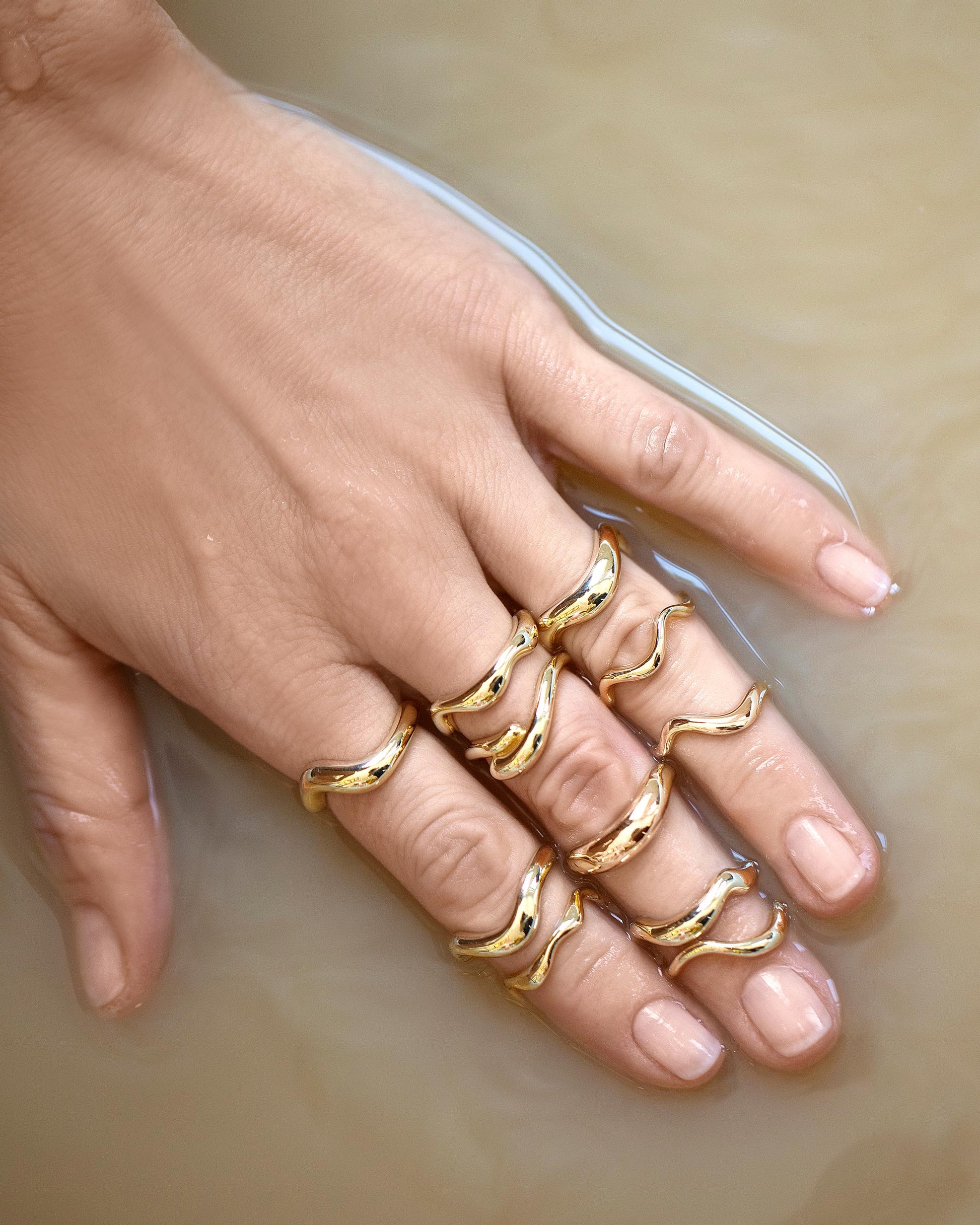 Group of Gold Bands from the Level Collection on model.