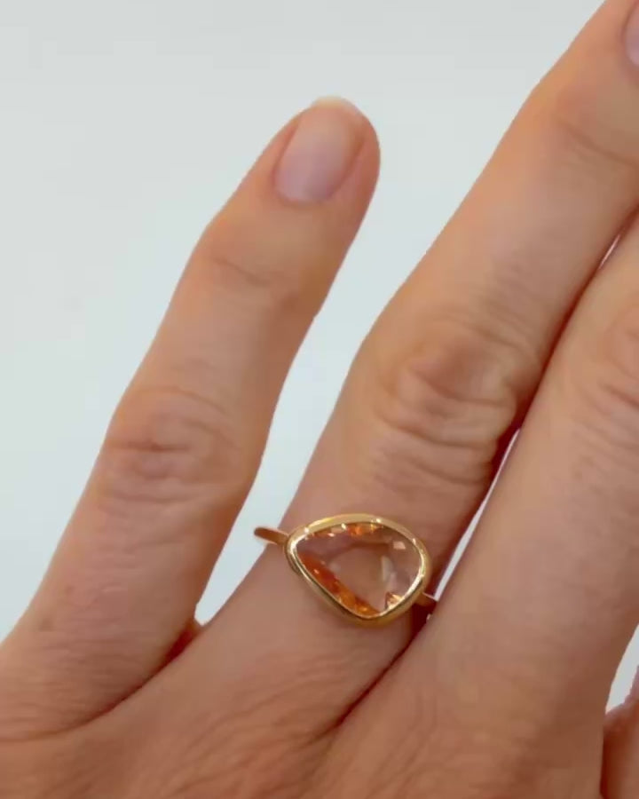 Peach Pink Sapphire Gusher Ring on model.