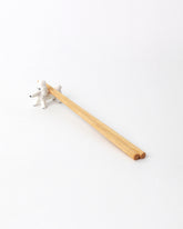 Eleonor Boström Poodle PARK Chopstick Dog Rest on light color background. Chopsticks not included.