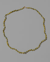 Ceto Necklace on light color background.