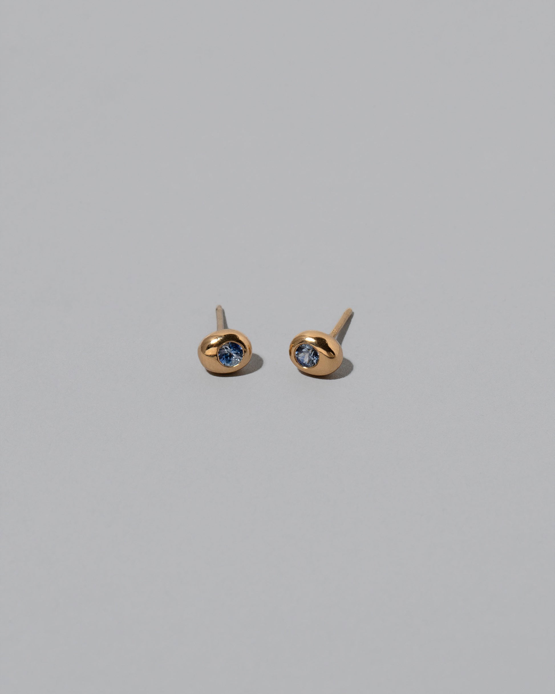 Yellow Gold Bicolor Blue Sapphire Level Stud Earrings on light color background