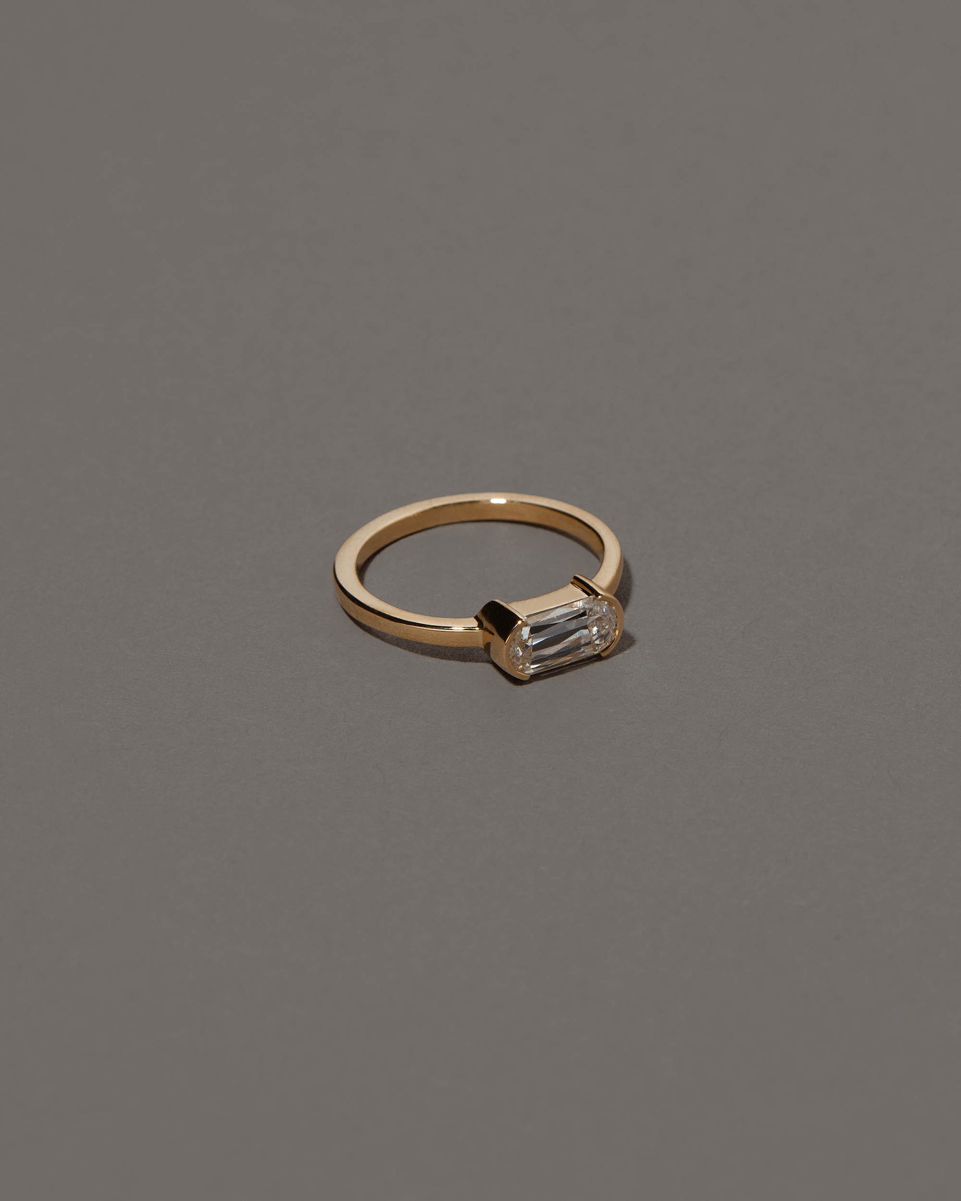 View from the side of the Conviviality Ring on grey color background.