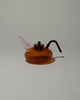 Ornamental by Lameice Amber & Pink Dreamlike Teapot on light color background.