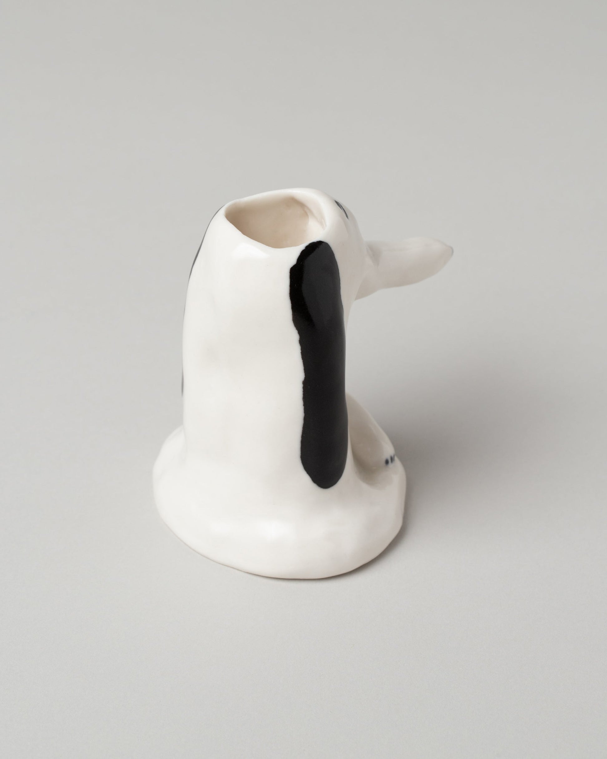 View from the back of the Eleonor Boström Dog Head Vase on light color background.