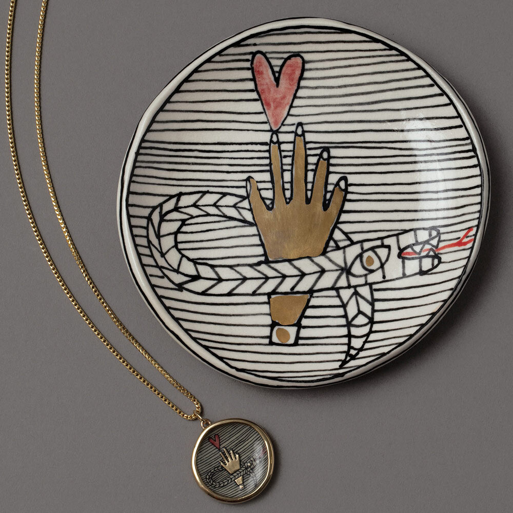 product_details::An Homage to Suzanne Pendant Necklace & Mini Dish on grey color background.