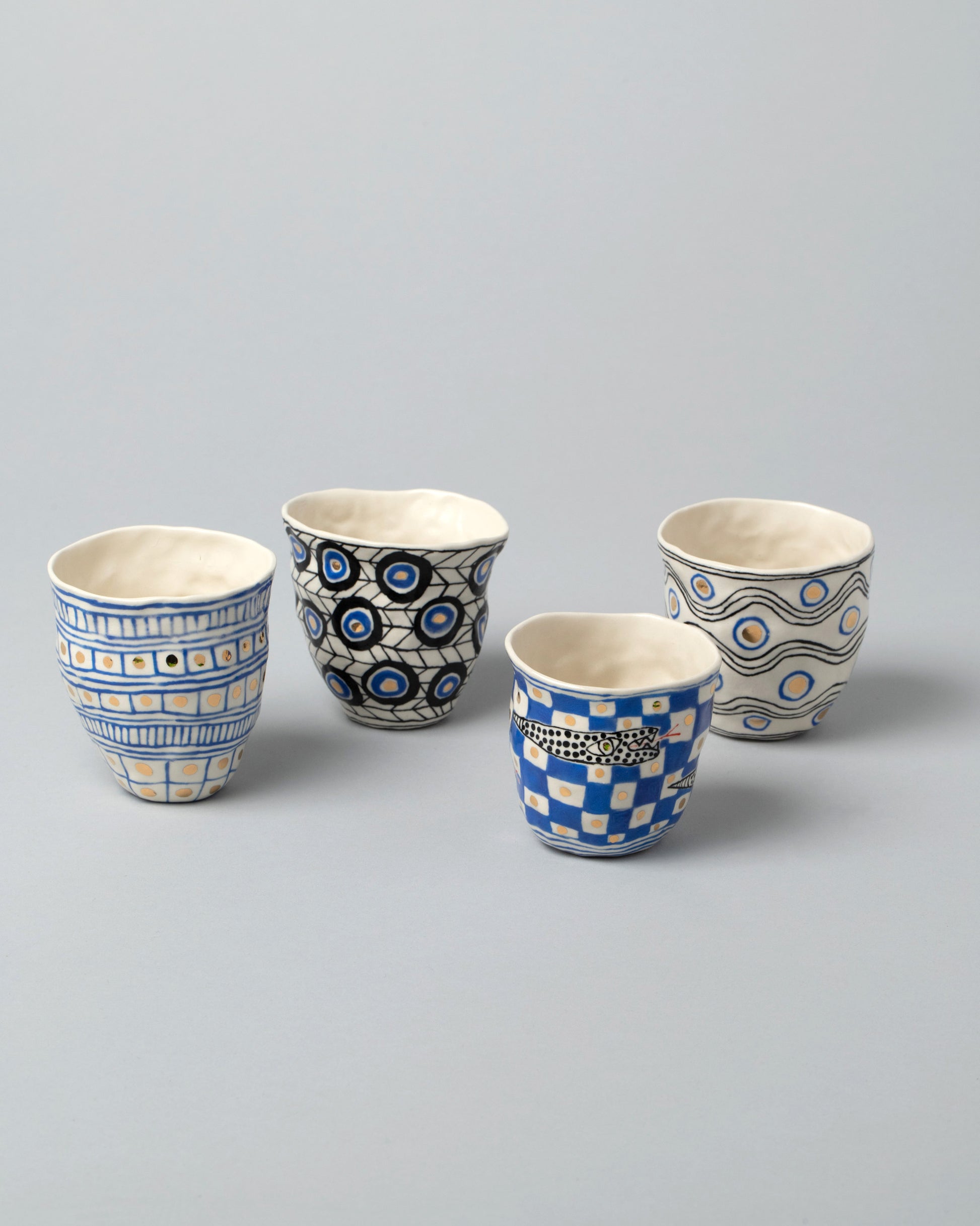 Group of Suzanne Sullivan Azul Tumblers on light color background.