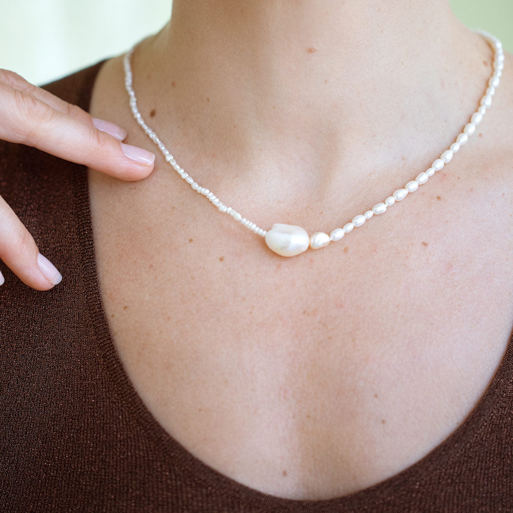 product_details::Pontus Pearl Necklace on model.