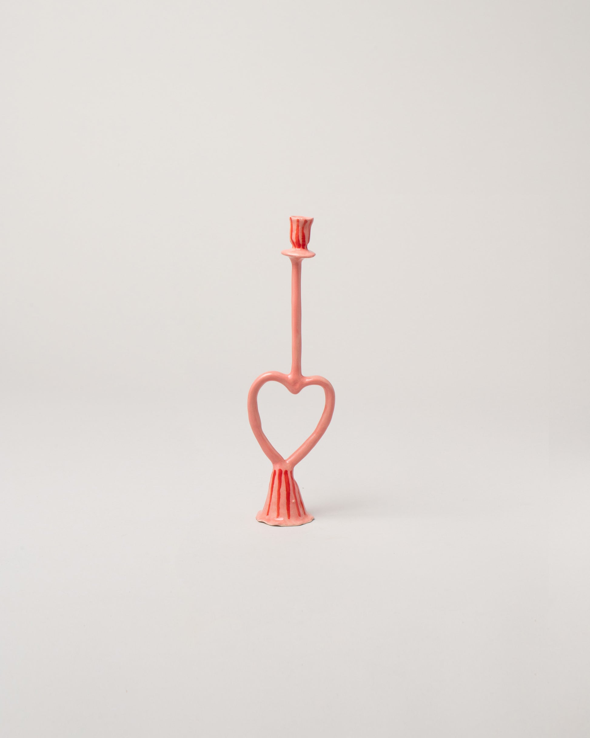 La Romaine Editions Stripes Open Heart-Shaped Candle Holder on light color background.