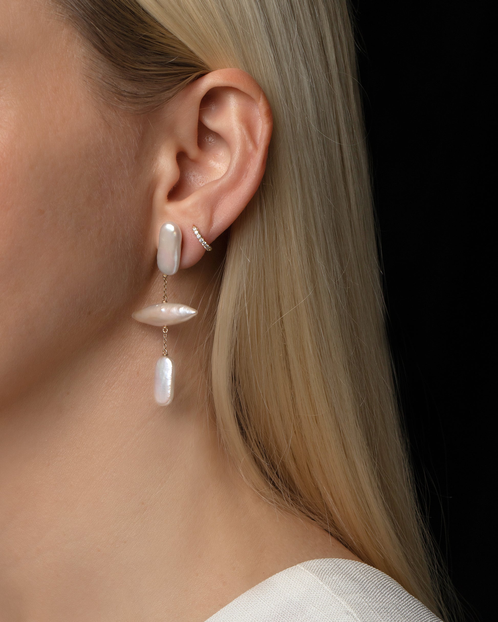 Gull Pearl Earrings on model.