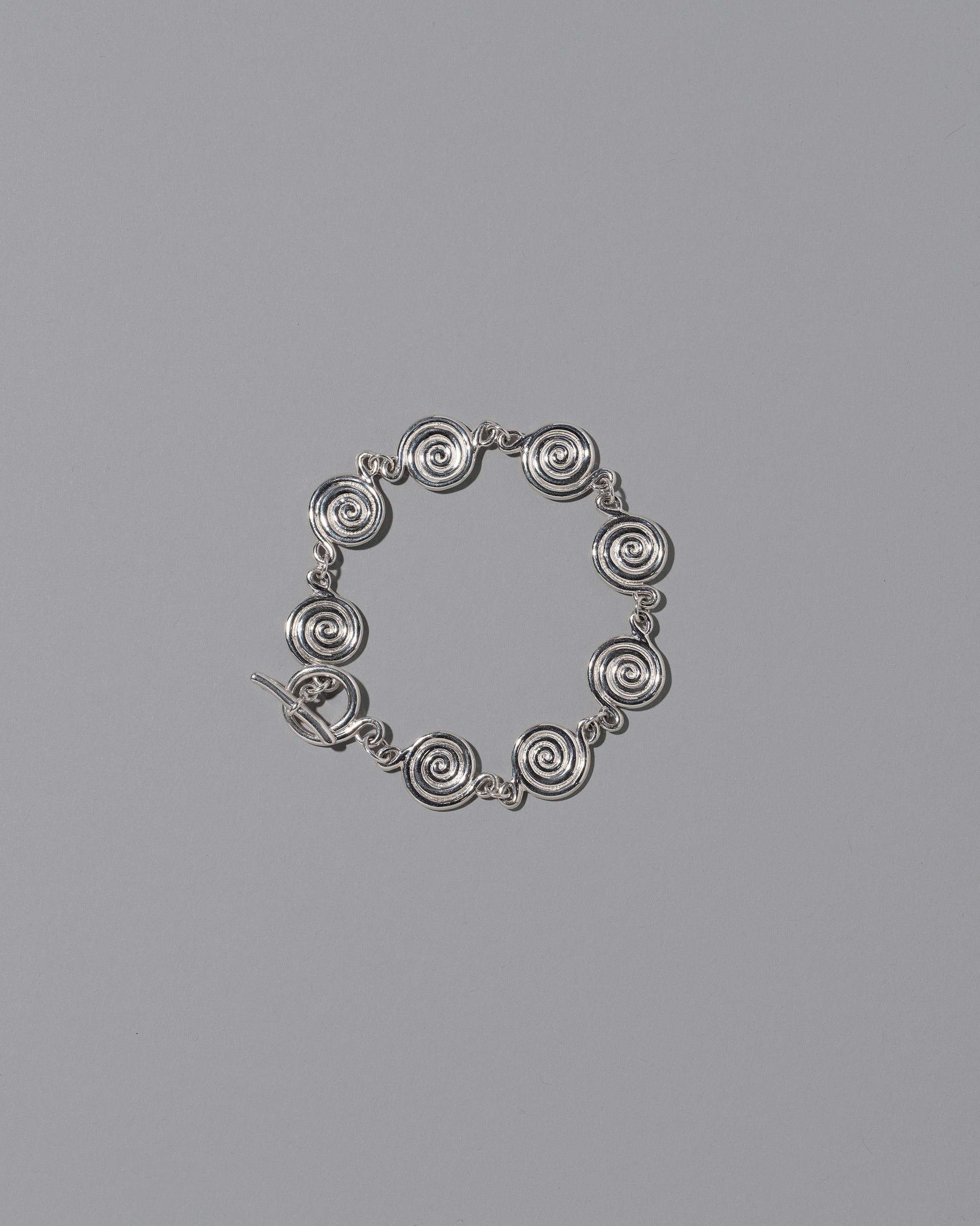 CRZM Sterling Silver Serpentinite Bracelet on light color background.