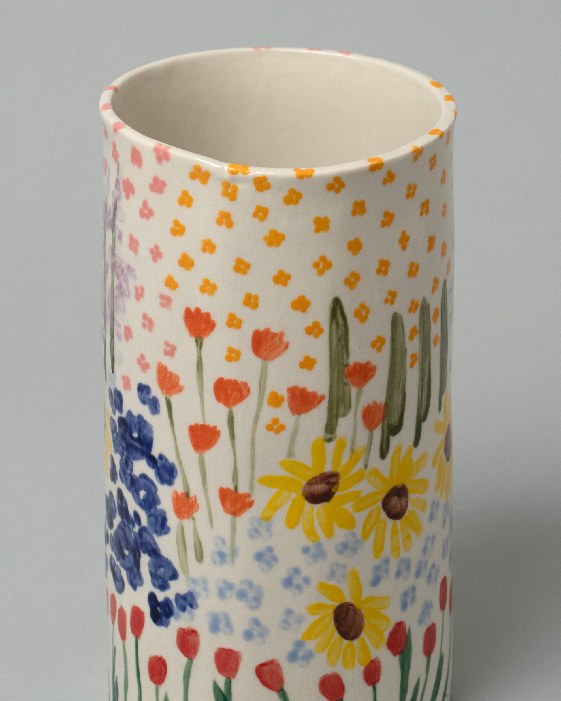 Closeup detail of the Amanda Lucia Côté Floral Vase on light color background.
