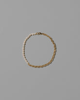 Half Short Loop Chain & White Seed Pearl Bracelet on light color background.