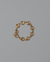 CRZM Gold Serpentinite Bracelet on light color background.