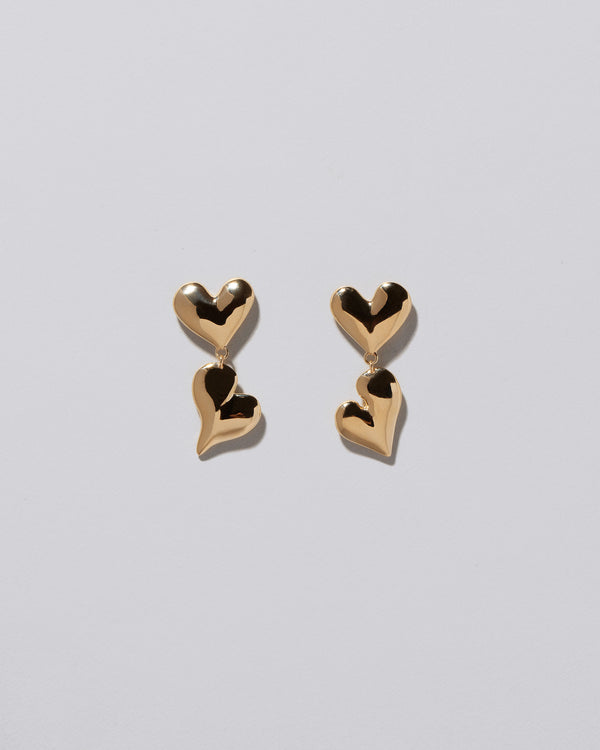 Thousand & One Night Heart Drop Earrings on light color background.