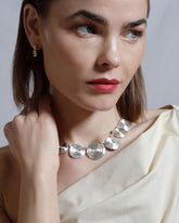 Styled image featuring CRZM jewelry on model.