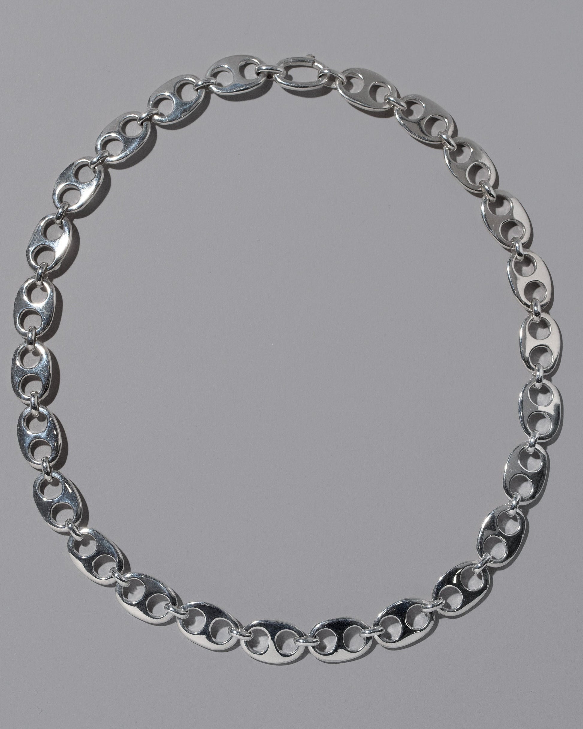 CRZM Sterling Silver Yuba Medium Necklace on light color background.