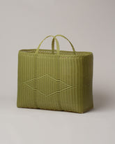 Palorosa Pistachio Extra Large Handwoven Tote Basket Bag on light color background.