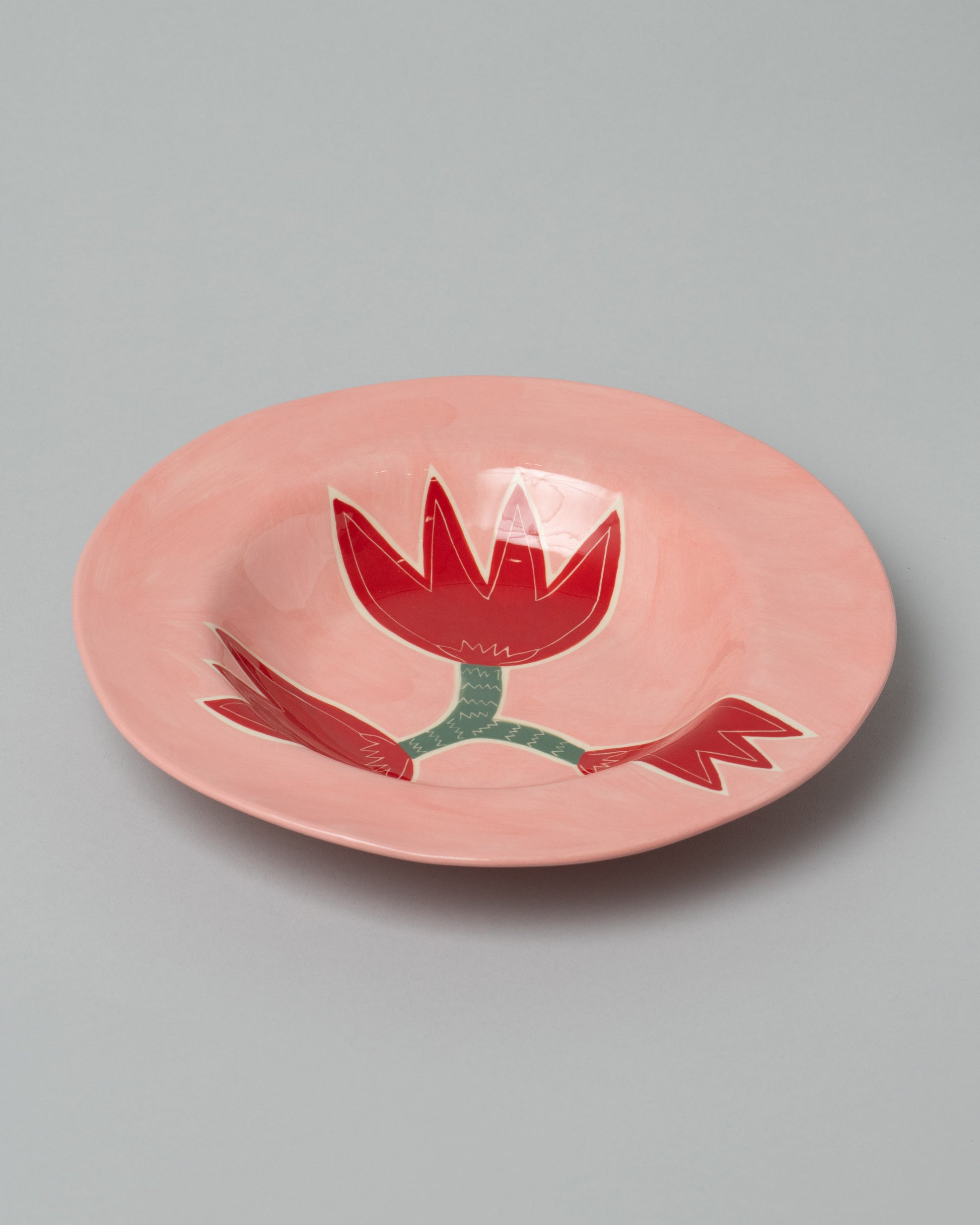 Laetitia Rouget Rose Dinner Plate on light color background.