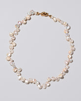 Tern Pearl Necklace on light color background.